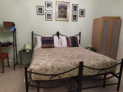 a bedroom with a large bed with pillows at roma capoccia b&b in Rome