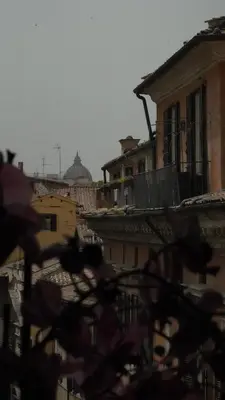 a view of a city from the roofs of buildings at Rhome Luxury suite in Rome