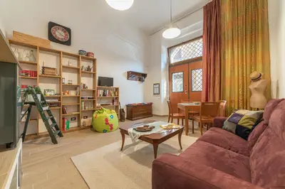 a living room with a couch and a table at GuestHost - Monti Artistic Flat in Rome