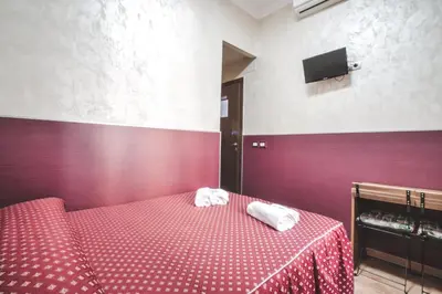 a bedroom with a bed with two towels on it at Vertex Homes in Rome