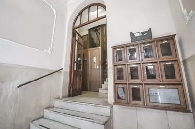 an entrance to a building with a wooden door at Vertex Homes in Rome