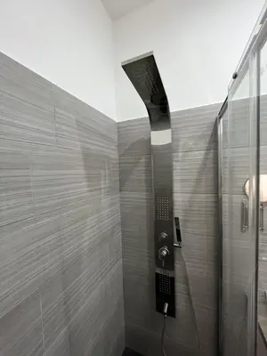 a shower with a glass door in a bathroom at Domus Flavia B&B in Rome