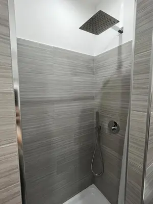 a bathroom with a shower with a toilet at Domus Flavia B&B in Rome
