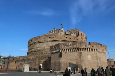 a large building with people standing in front of it at Residenza Adriana in Rome