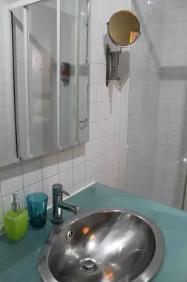 a bathroom with a sink and a mirror at Relais Palazzo Taverna in Rome
