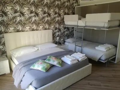 a bedroom with a bed with pillows on it at Appia Garden in Rome