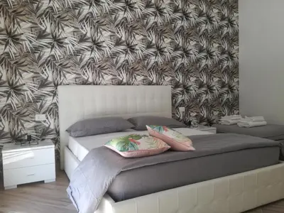 a bedroom with a bed with two pillows on it at Appia Garden in Rome