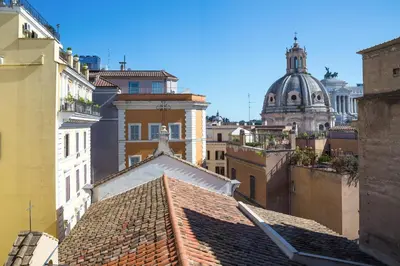 a view of the roofs of buildings in a city at Rent in Rome - IV Novembre in Rome