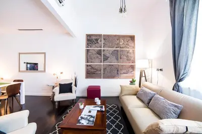 a living room with a couch and a table at Rent in Rome - IV Novembre in Rome