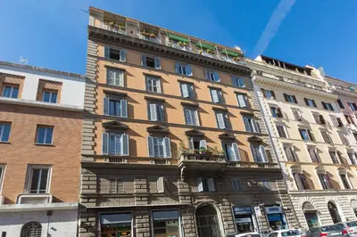 a large brick building with a lot of windows at Filomena Arthouse in Rome