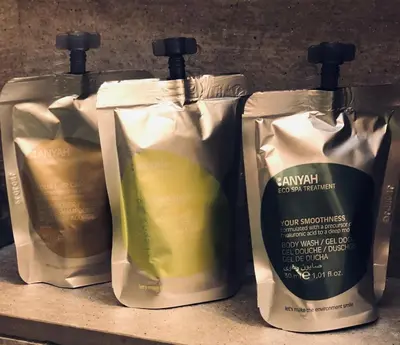 three bottles of laundry detergent sitting on a shelf at Belsiana Luxury Apartment in Rome