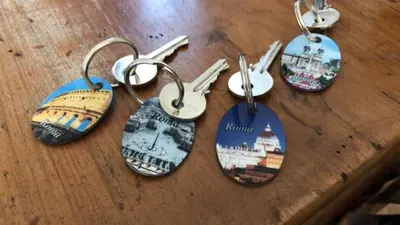a group of keychains with photos of cities on them at Belsiana Luxury Apartment in Rome