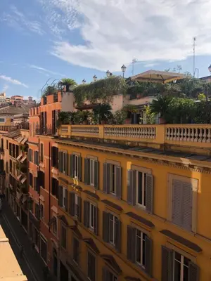 a row of buildings in a city with trees at Belsiana Luxury Apartment in Rome