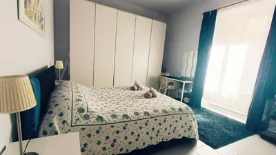 a small bedroom with a bed and a window at Lovely 5 min walk to Saint Peter Basilica in Rome