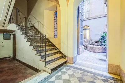 an empty hallway with stairs in a building at GuestHost - Spanish Steps Luxury Apartment in Rome