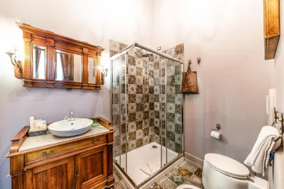 a bathroom with a sink and a shower and a toilet at Navona Grand Suite in Rome