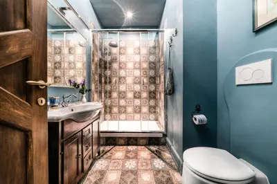 a bathroom with a shower and a toilet and a sink at Navona Grand Suite in Rome