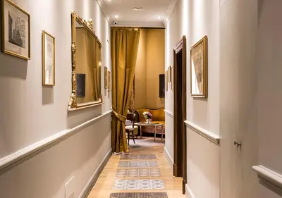 a hallway leading to a room with a table at Navona Grand Suite in Rome