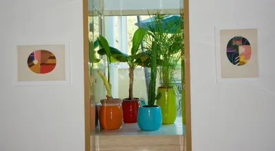 a shelf with vases and plants on it at La Terrazza di Isabel in Rome