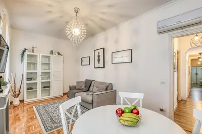 a living room with a table with fruit on it at ATRHOME penthouse Frattina in Rome