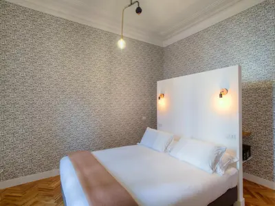 a bedroom with a white bed with two white pillows at App Beccaria Apartments in Rome in Rome