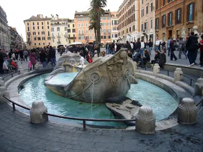a statue of a dog in a fountain in a city at Porta Pia Comfy Rooms in Rome