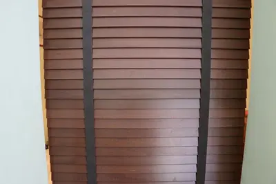 a brown wooden garage door with black rails at your Rome basic but bonnie corner in Rome