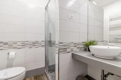 a white bathroom with a sink and a toilet at Garden Rooms by Casa Proto in Rome