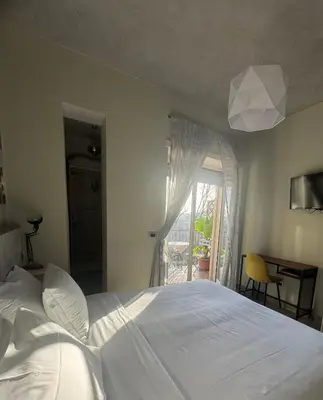 a bedroom with a large bed and a window at Stileroma in Rome