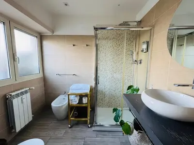 a bathroom with a tub and a sink and a shower at Stileroma in Rome