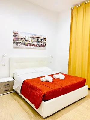 a bedroom with a bed with two towels on it at Tawhid Accomodation in Rome