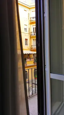 a view of a building from a window at Bespoke Roma Suites in Rome