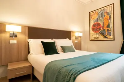a hotel room with a large bed and a movie poster at Archi di Roma Guest House in Rome