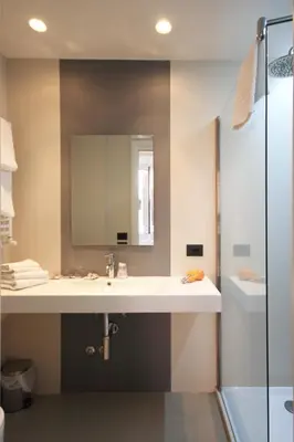a bathroom with a sink and a mirror at Manin Suites LT in Rome