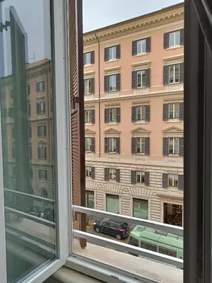 a window with a view of a building at Manin Suites LT in Rome