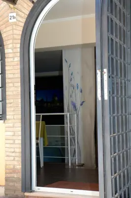 an open door to a room with a vase at Villa Matissa Apartments in Rome