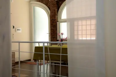 a dining room with a table and a window at Villa Matissa Apartments in Rome