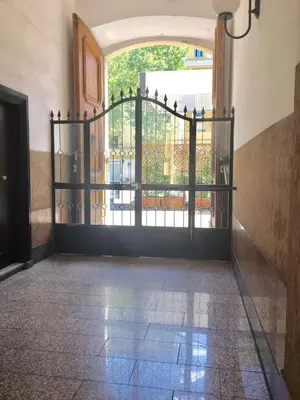 an entrance to a building with an iron gate at Luxy Vatican Apartment in Rome
