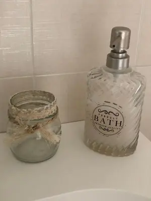 a bottle of soap sitting on top of a sink at Luxy Vatican Apartment in Rome