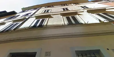 a building with many windows on the side of it at Grotte Flat in Rome