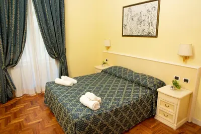 a hotel room with a bed with towels on it at Annette B&B in Rome