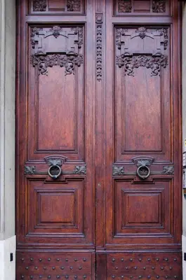 a pair of wooden doors in a building at Annette B&B in Rome