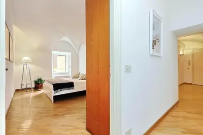 a bedroom with a bed and a window in a room at Clementina Charme - My Extra Home in Rome