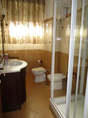 a bathroom with a toilet and a sink and a shower at INTERNO DIECI in Rome