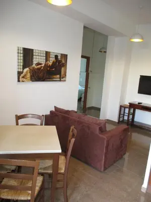 a living room with a couch and a table at INTERNO DIECI in Rome