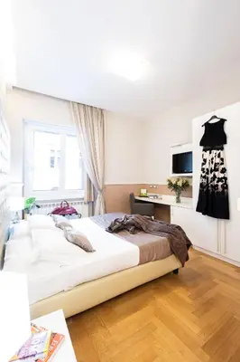 a bedroom with a large bed in a room at Rome River Inn in Rome