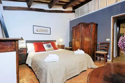 a bedroom with a bed with two towels on it at San Callisto in Rome