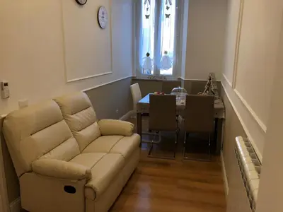 a living room with a couch and a table at Pantheon Luxury Suite in Rome