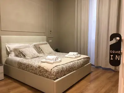 a bedroom with a bed with two towels on it at Pantheon Luxury Suite in Rome