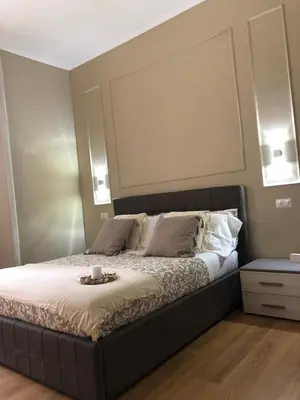 a bedroom with a bed with a mirror above it at Pantheon Luxury Suite in Rome